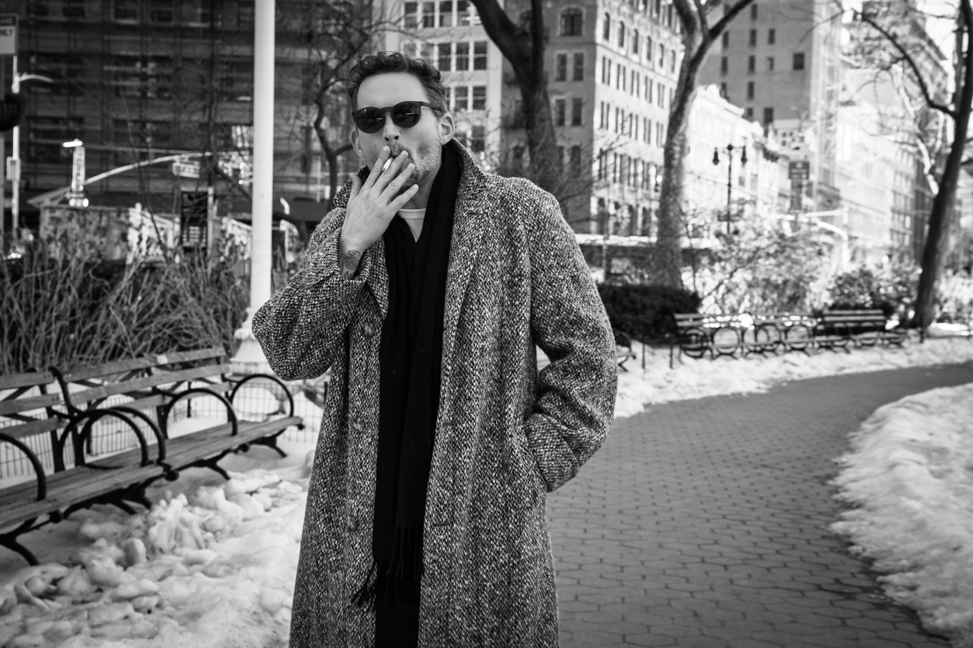 Image of author in park smoking a cigarette.